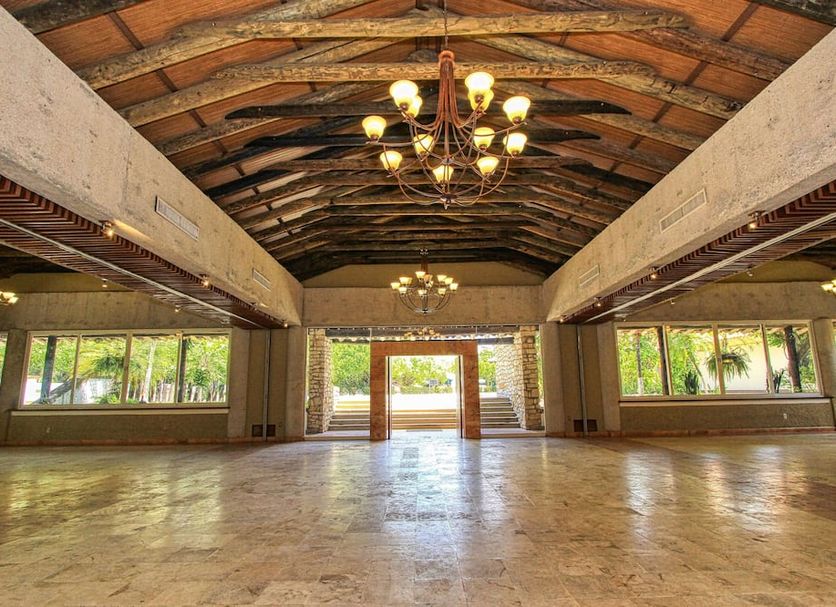 Hotel Ciudad Real Palenque — summit venue with vaulted timber ceiling